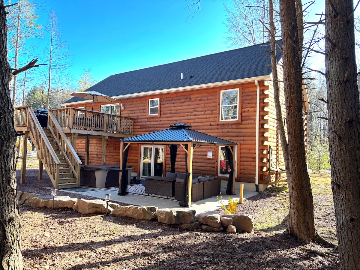 The three-story Driftwood Retreat log cabin in the Poconos